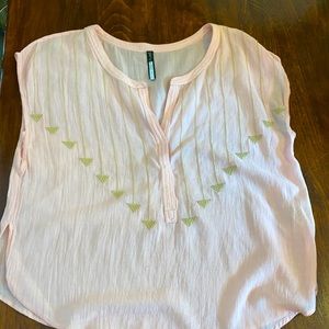 Light pink blouse with tan crocheted arrows